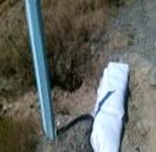 A white bag on the ground

Description automatically generated