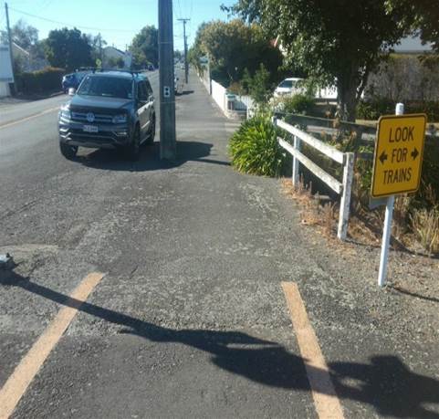 A car parked on the side of a road

Description automatically generated