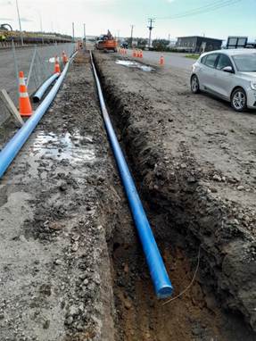 A blue pipe in the dirt

Description automatically generated