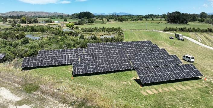 A large solar panel in a field

AI-generated content may be incorrect.