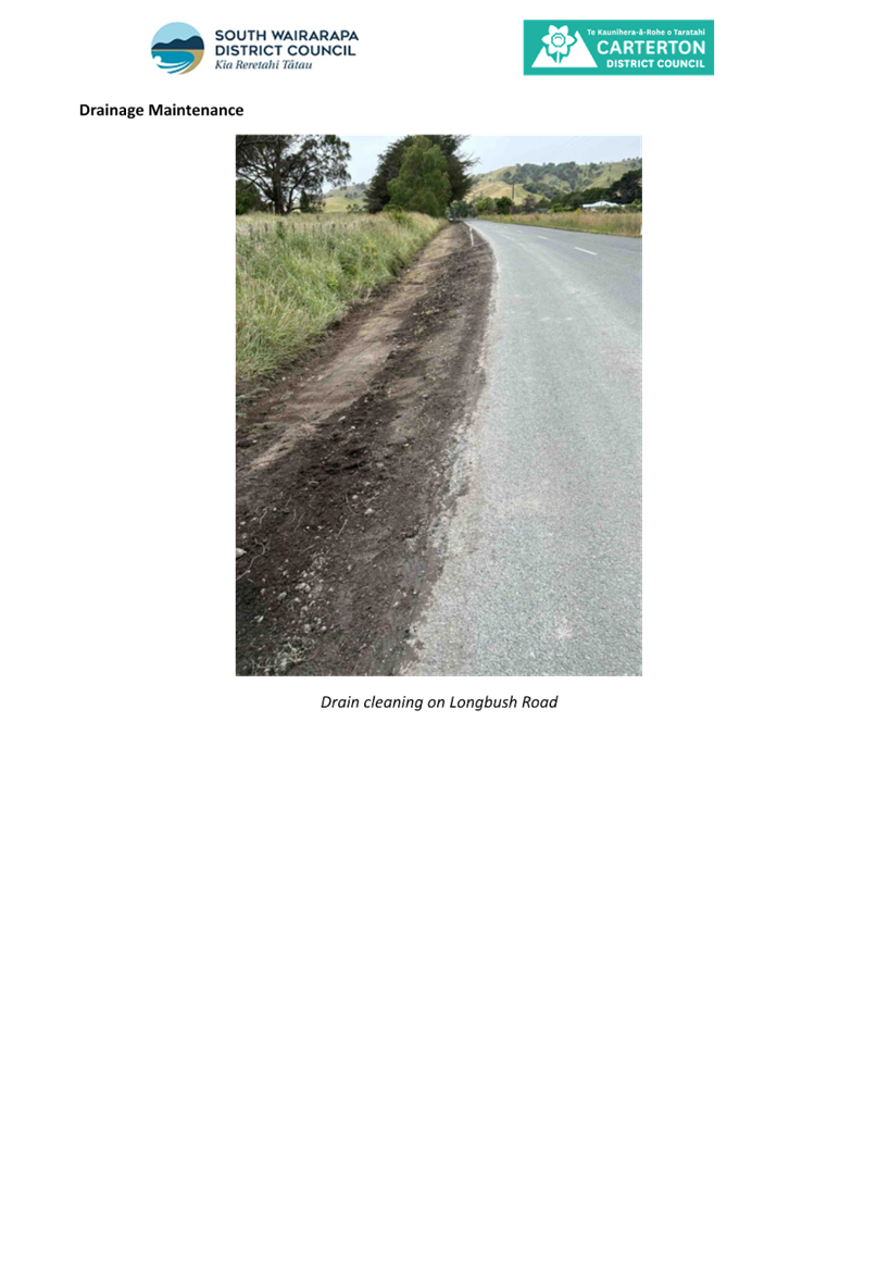 A road with dirt and grass

AI-generated content may be incorrect.