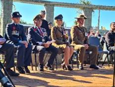 A group of people in military uniforms sitting on chairs

AI-generated content may be incorrect.