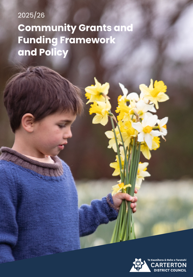A child holding flowers

AI-generated content may be incorrect.