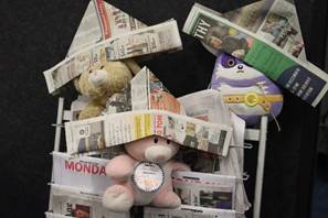 Stuffed animals with newspaper hats

AI-generated content may be incorrect.