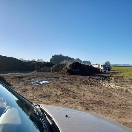A truck driving through a dirt field
AI-generated content may be incorrect.